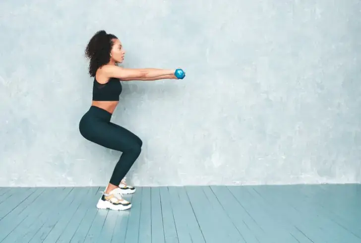 Image by halayalex on Freepik | Perform this exercise, grasp a pair of dumbbells, holding them next to your shoulders.